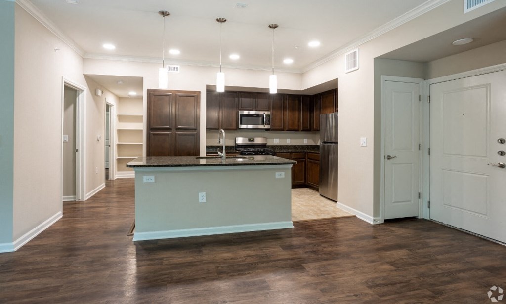 a large kitchen with a large island in the middle of it