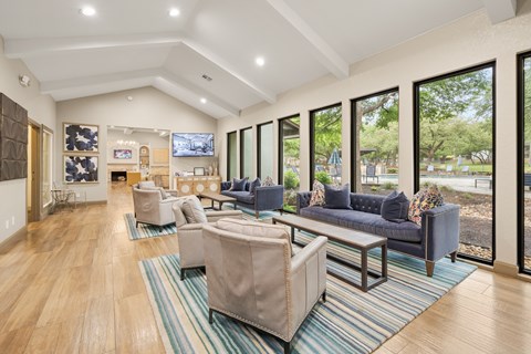 A living room with a blue couch and a television.