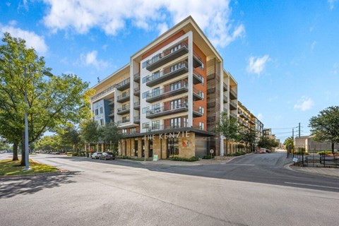A large apartment building with the name "NEXUS" on the front.