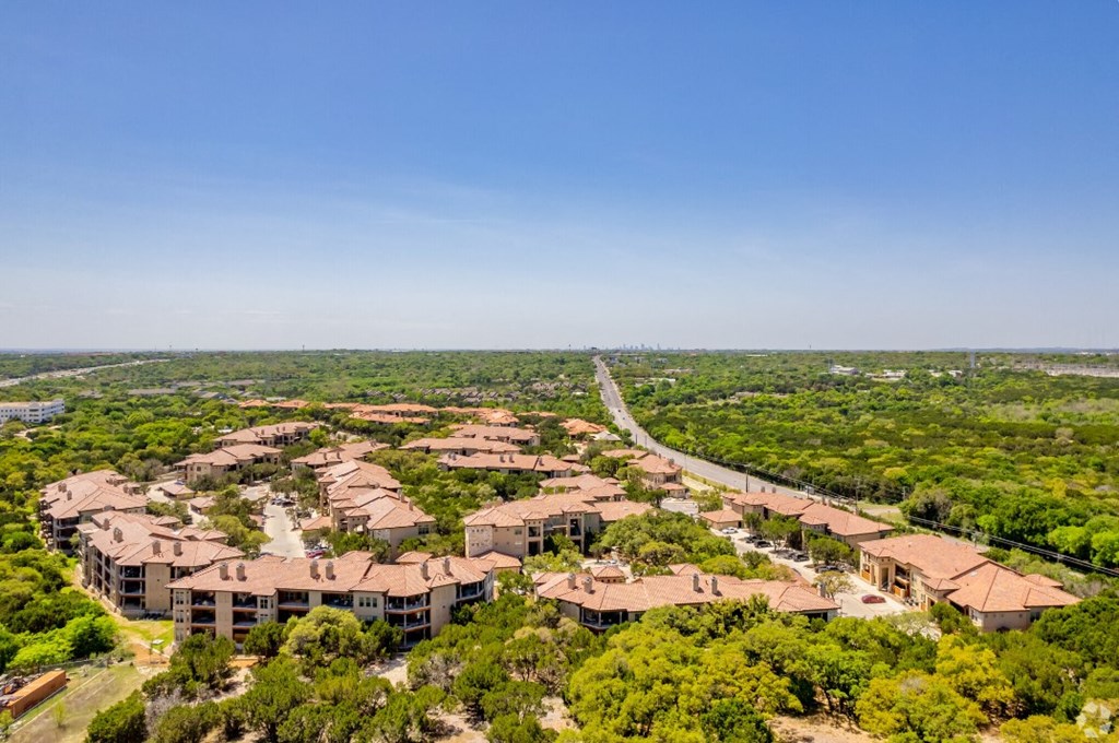 an aerial view of a neighborhood with houses and trees