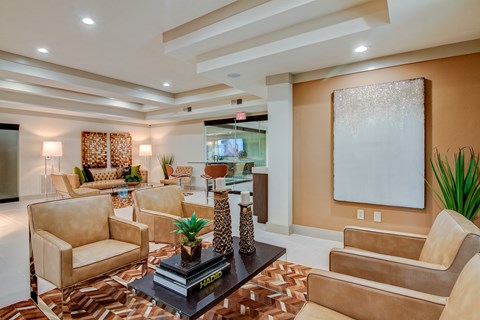 a living room with couches and chairs and a coffee table