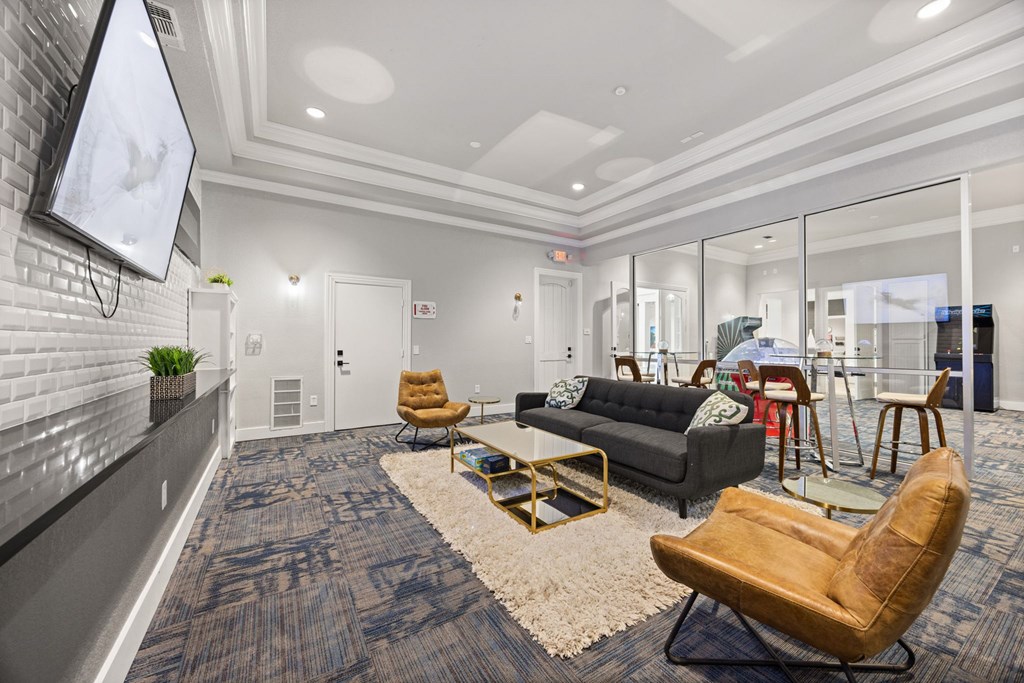 A modern living room with a grey carpet and a wooden chair.