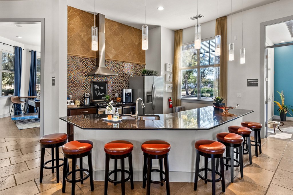 European-Style Kitchen With Breakfast Bar at Bridge at Indigo, Texas