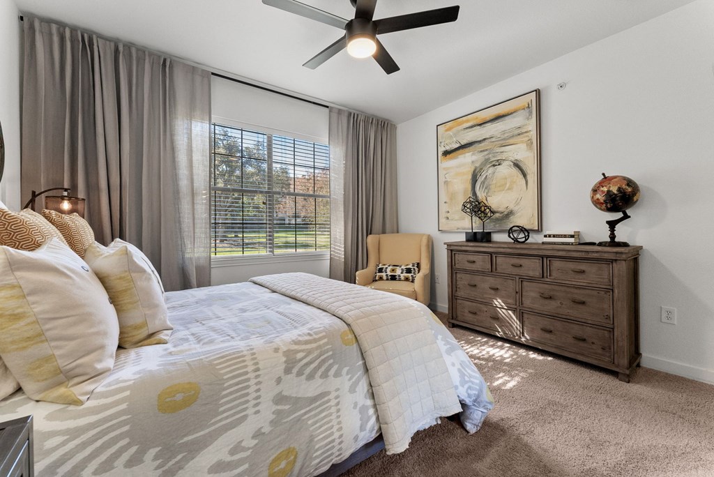Bedroom With Ceiling Fan at Preserve at Rolling Oaks, Austin