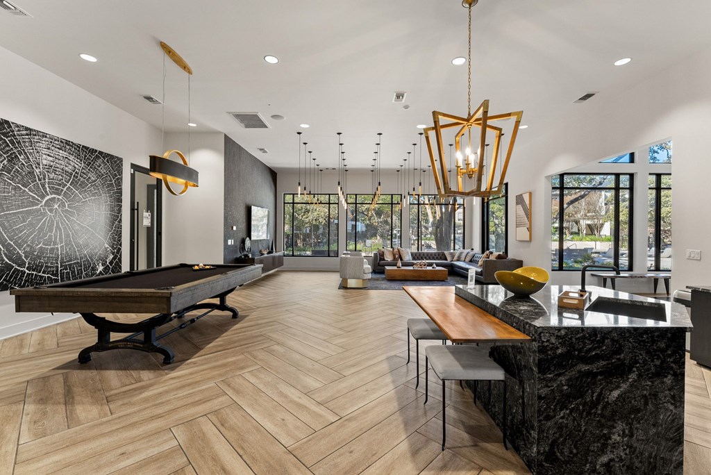 A modern kitchen with a pool table. at Preserve at Rolling Oaks, Texas, 78728