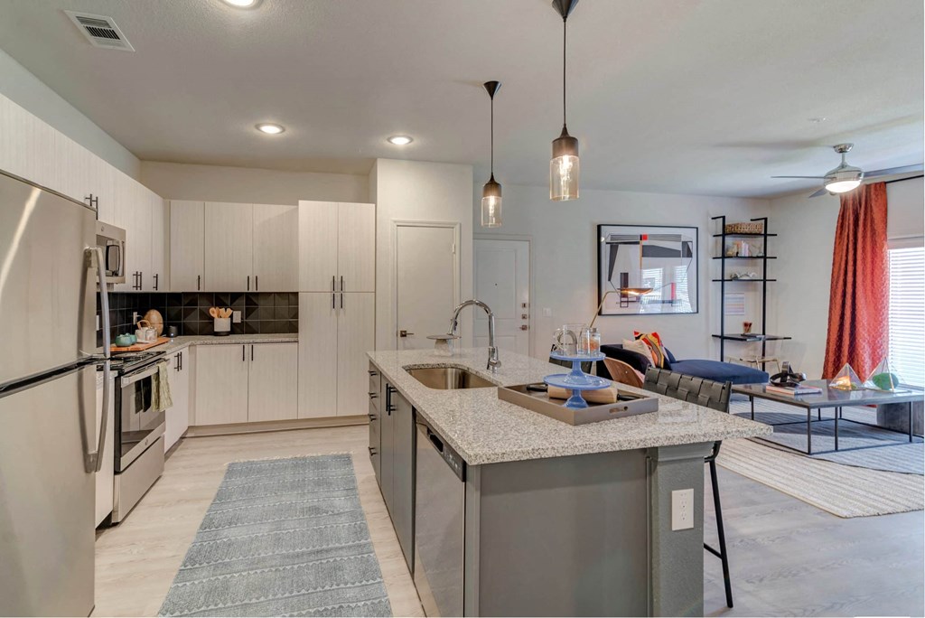 a kitchen with a counter top and a sink