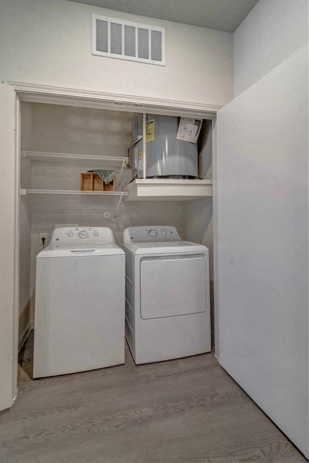 a washer and dryer in a laundry room with white appliances