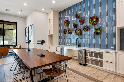 A kitchen with a wooden table and chairs. at The Haywood Apartments, Texas, 78748
