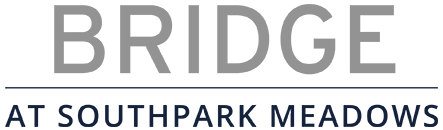 A sign that says Bridge at Southpark Meadows.