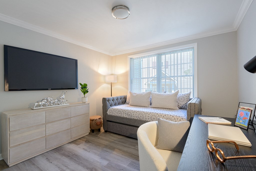 a living room with a couch and a tv