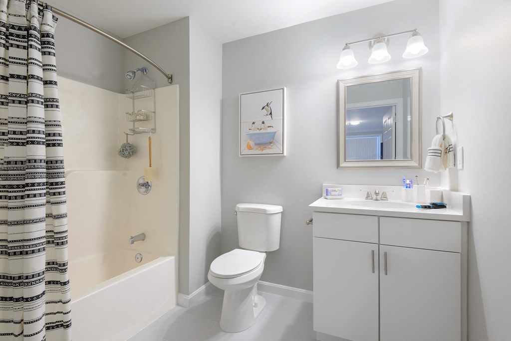 a bathroom with a bathtub toilet and sink