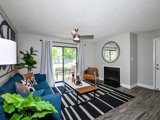Open living room with large window and hardwood floors at 15Seventy, Chesterfield, MO 63017 - Photo Gallery 5