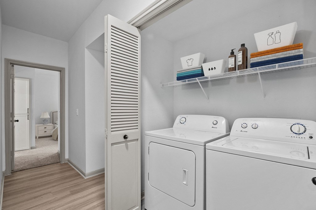 laundry room with stand alone washer and dryer at The Aster Sugar Land, Sugar Land