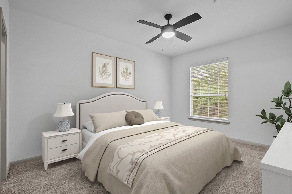 white bedroom with large tan bed