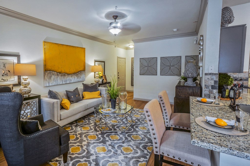 Living Room With Kitchen View at The Aster Sugar Land Apartments, Sugar Land, Texasar Land