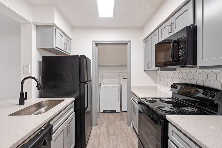 Renovated Kitchen with Black Appliances located at 1900 Rosemont in Roswell, GA 30076 - Photo Gallery