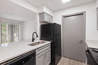 Renovated Kitchen with Black Appliances located at 1900 Rosemont in Roswell, GA 30076 - Photo Gallery 4
