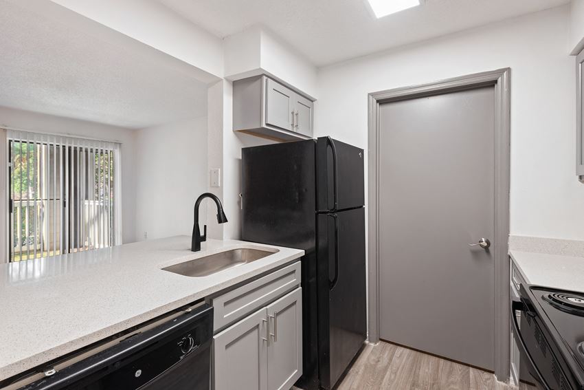 Renovated Kitchen with Black Appliances located at 1900 Rosemont in Roswell, GA 30076 - Photo Gallery