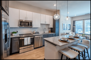 a kitchen with stainless steel appliances and granite counter tops