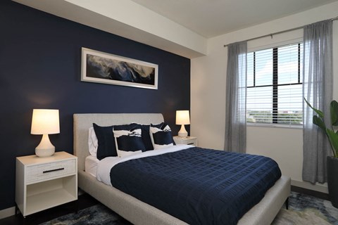 Bedroom with cozy bed at Azola West Palm Beach, Florida, 33411