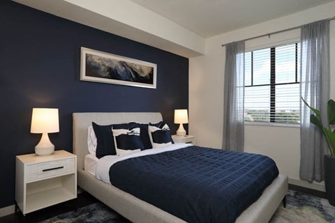 Bedroom with cozy bed at Azola West Palm Beach, Florida, 33411