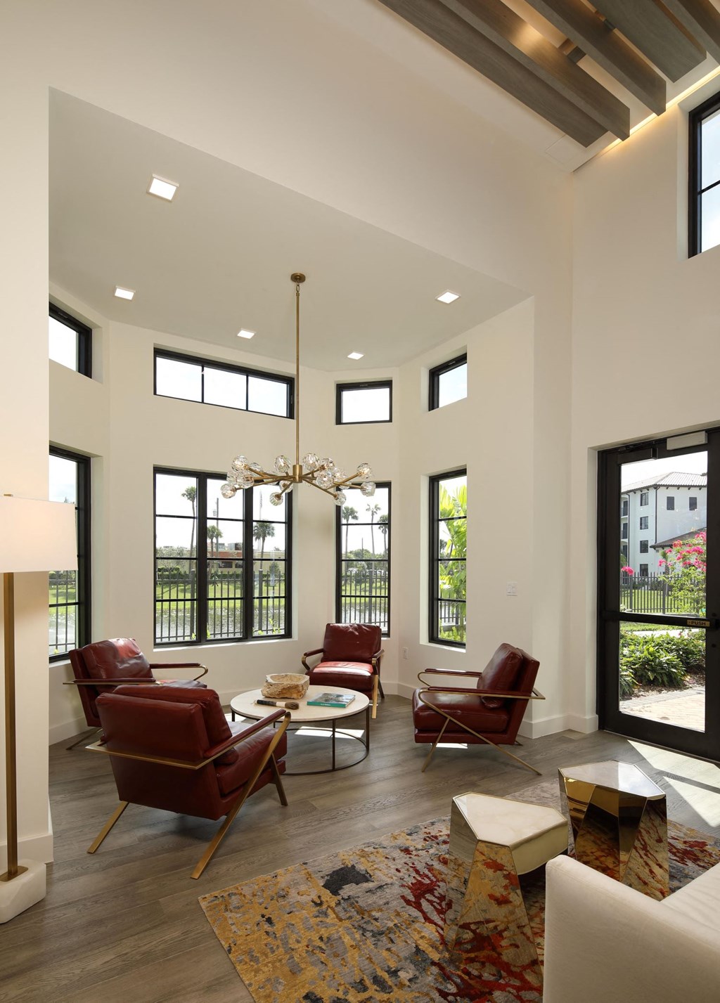 Beautiful ceiling lights in modern living room with dining at Azola West Palm Beach, West Palm Beach, FL, 33411