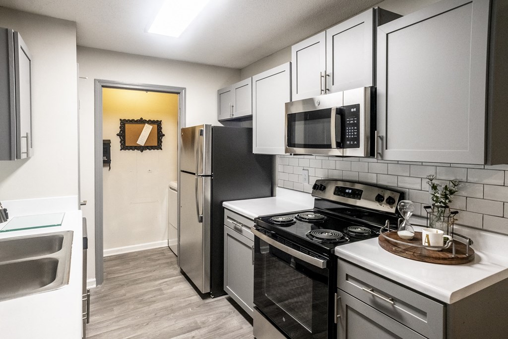 Kitchen with granite countertops at Addison at Collierville Apartments in Collierville TN 38017