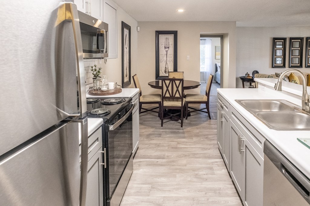 Kitchen and dining room at  Addison at Collierville Apartments in Collierville TN 38017