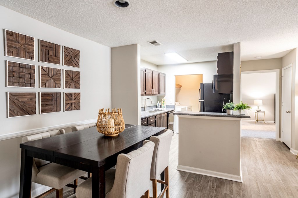 Dining Room overlooking Kitchen located at Addison on Cobblestone located in Fayetteville, GA 30215