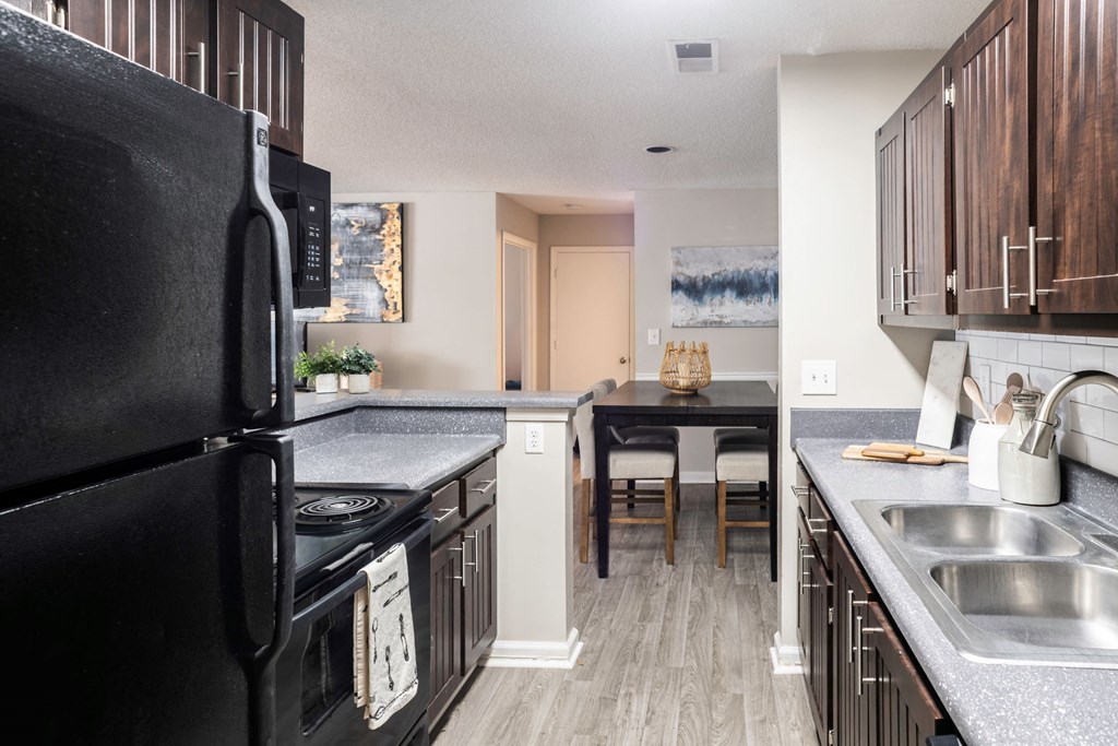 Galley Kitchen leading to Dining Room located at Addison on Cobblestone located in Fayetteville, GA 30215