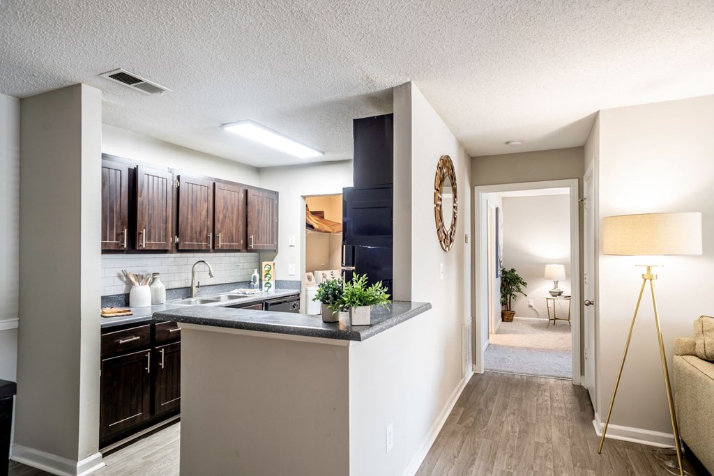 Kitchen and hallway to bedroom located at Addison on Cobblestone located in Fayetteville, GA 30215