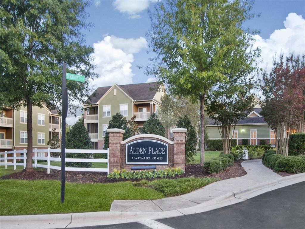 Lush landscaping surrounds you as you drive at Alden Place at South Square Apartments, Durham, NC 27707