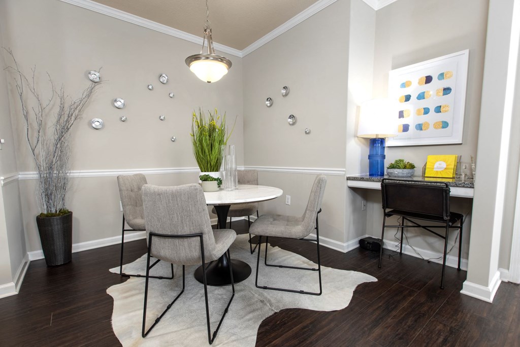 a dining room with a table and chairs at Ansley at Town Center in Evans GA