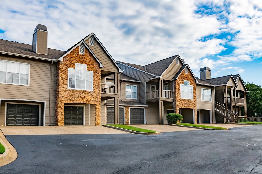 the view of two story apartment buildings with balconies and garages at Appling Lakes, Cordova, TN, 38016