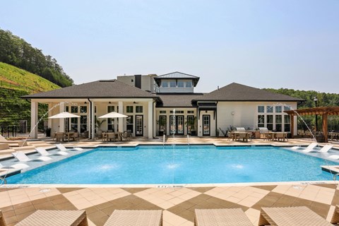 A large house with a pool in front at Arcadia Cartersville Apartments, Cartersville, Georgia