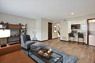Living Room With Kitchen View at Artesian East Village in Atlanta