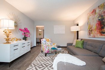 Bright Open Den Living Space with Wood Plank Vinyl Flooring Amble Room for Couches and Furniture at Artesian East Village, Atlanta, GA 30316 - Photo Gallery 6