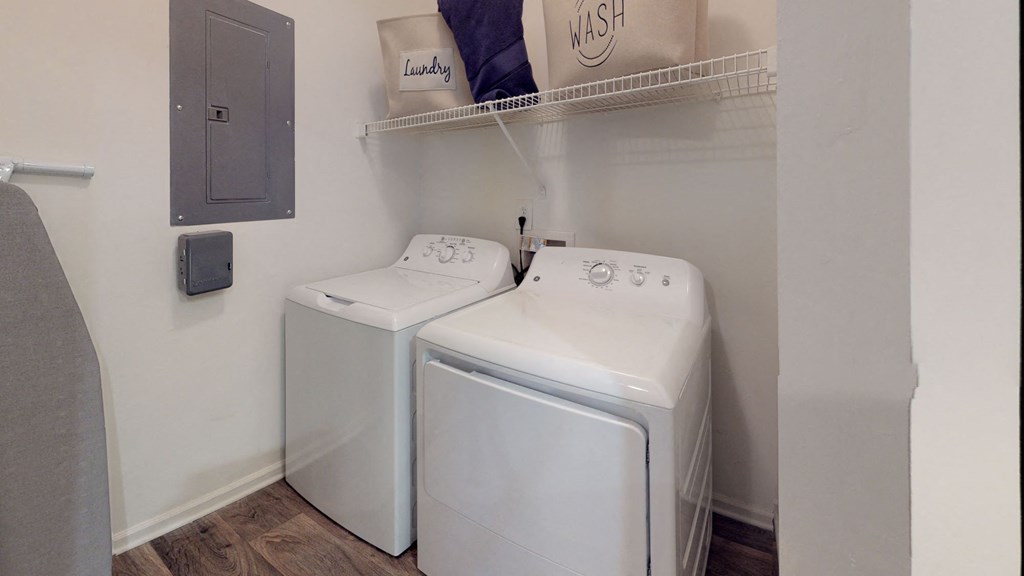 a washer and dryer in a laundry room at Autumn Park Apartments, North Carolina
