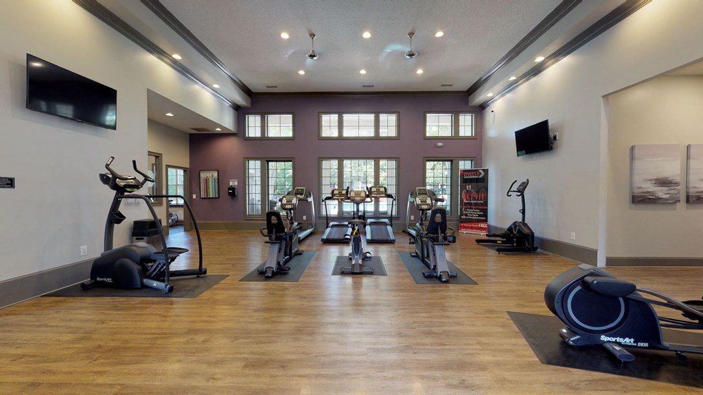 a gym with treadmills and other exercise equipment at Autumn Park Apartments, Charlotte, North Carolina