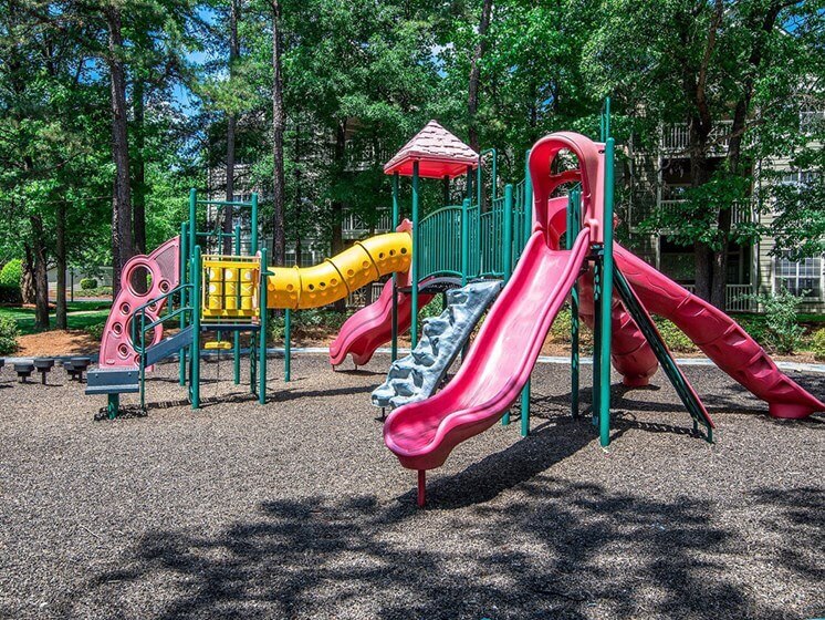 Children have a place to run and play at Autumn Park too! Slides, Climbing Equipment and Racetrack at Autumn Park Apartments, Charlotte, NC 28262