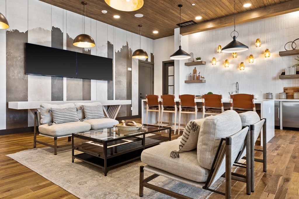 a living room with couches and chairs and a table