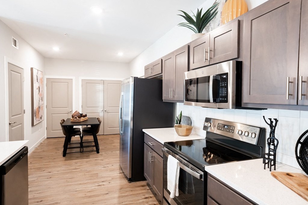 a kitchen and dining area in a 555 waverly unit