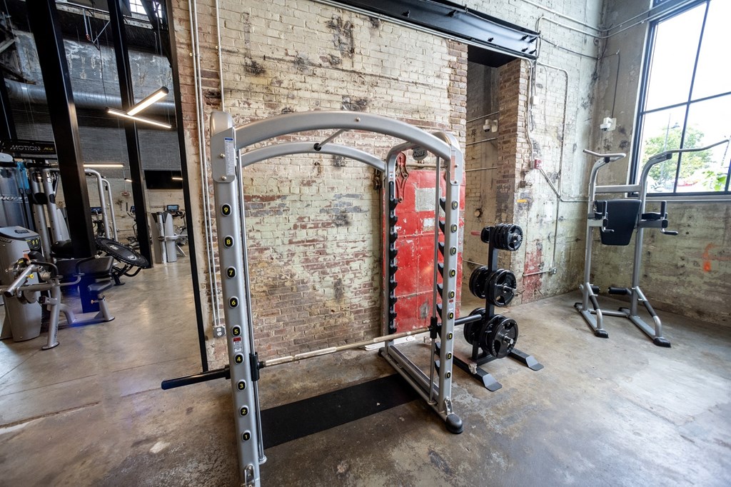 a gym with a brick wall and a red door in the background a gym with a brick wall and a red door in the background at Conwood Flats, Memphis, TN