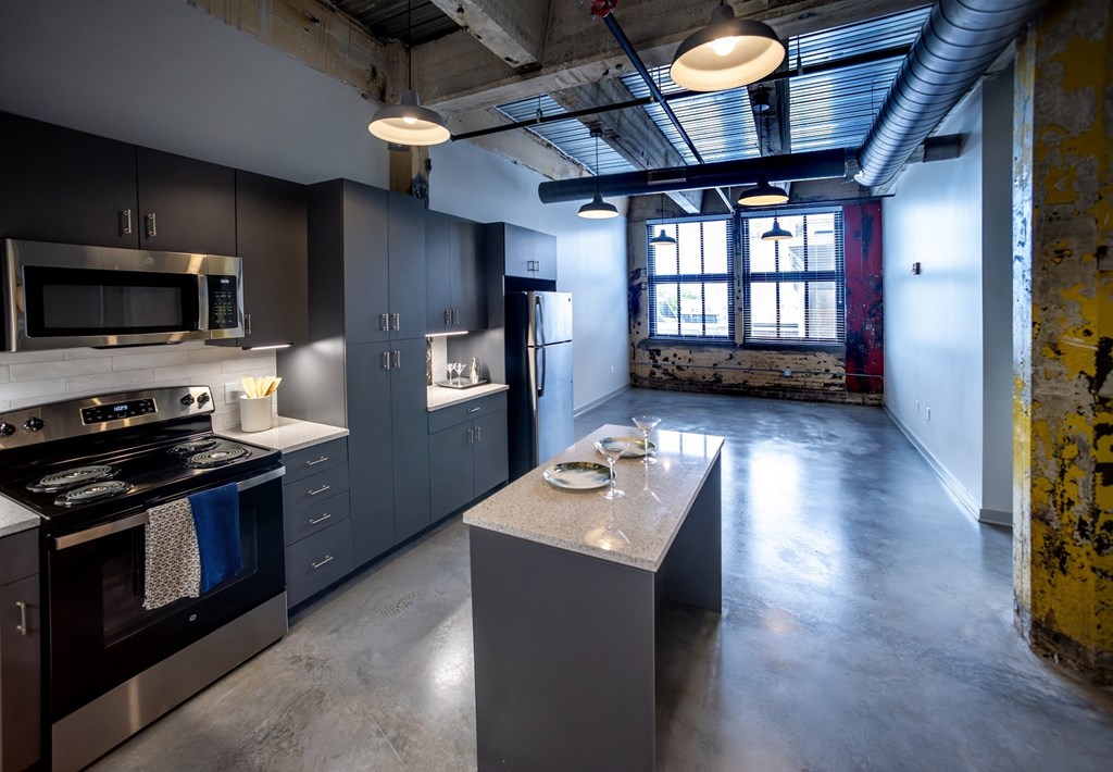 a kitchen with a large island and stainless steel appliances a kitchen with a large island and stainless steel appliances at Conwood Flats, Memphis, Tennessee