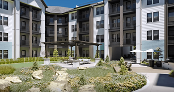 a rendering of an apartment building with an outdoor courtyard