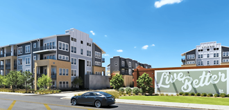 a rendering of an apartment complex with a car driving by