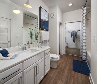 Relax in your Stunning Bathroom with Double Vanity Sinks, Subway Tile Showers with Glass Enclosures and Full Length Mirrors at Echo at North Pointe Center Apartment Homes, Alpharetta, GA 30009 - Photo Gallery 4