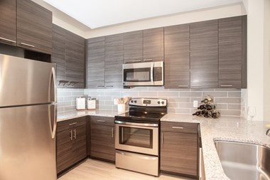 Model kitchen cabinetry at Fifth Street Place Apartments, Charlottesville, VA, 22903 - Photo Gallery 2