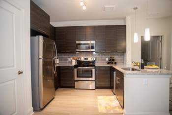 Fully Equipped Kitchen Fully Equipped Kitchen at Fifth Street Place Apartments, Virginia - Photo Gallery 3