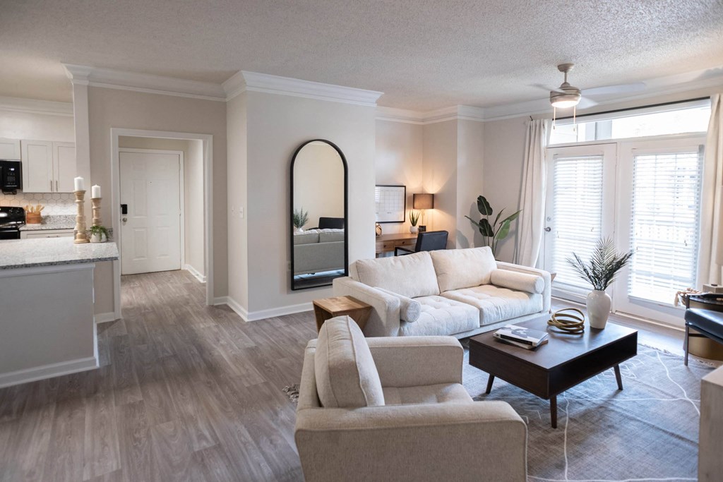 a living room filled with furniture and a large window at Appling Lakes, Cordova